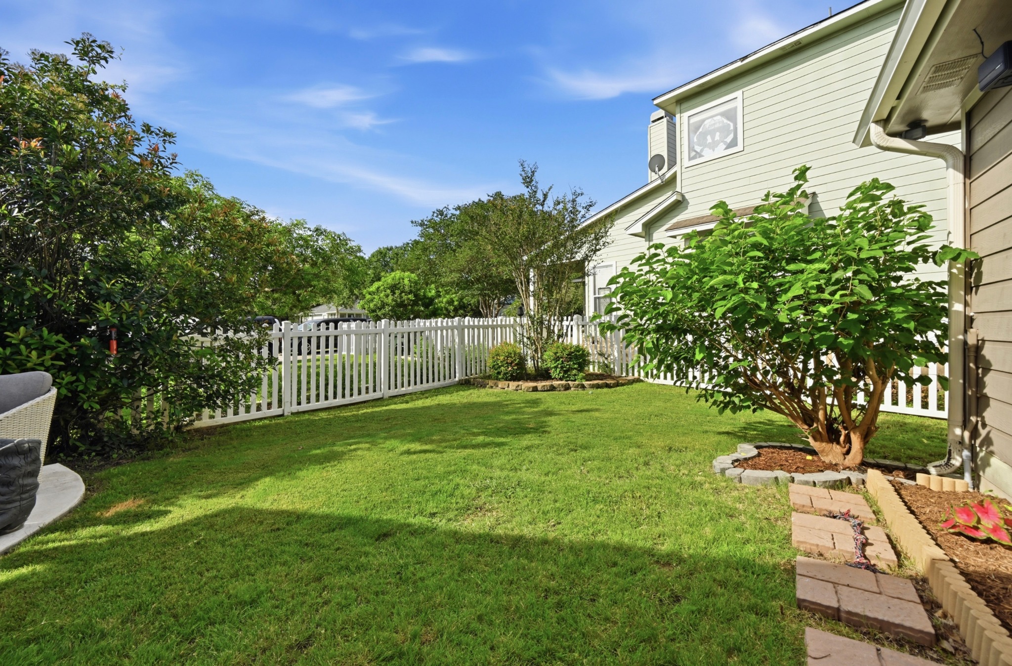 5888 Fergus Kyle, TX 78640 - Photo 30 of 40 A well-maintained lawn with a charming white picket fence defines this peaceful private yard.