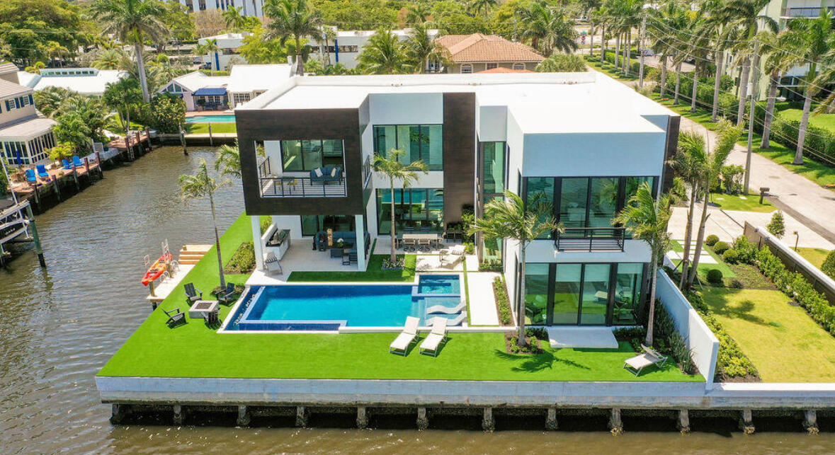 a view of house with a swimming pool