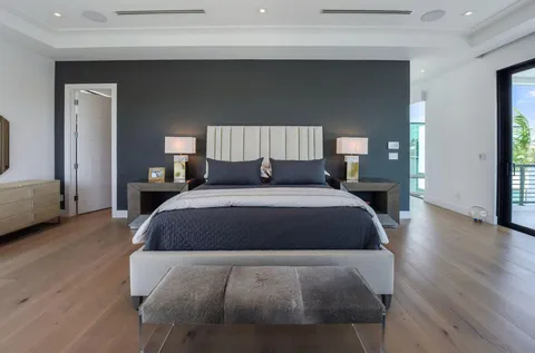 a spacious bedroom with a bed and a couch