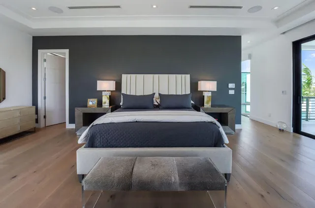 a spacious bedroom with a bed and a couch