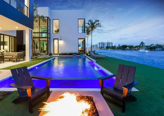 a view of swimming pool with outdoor seating