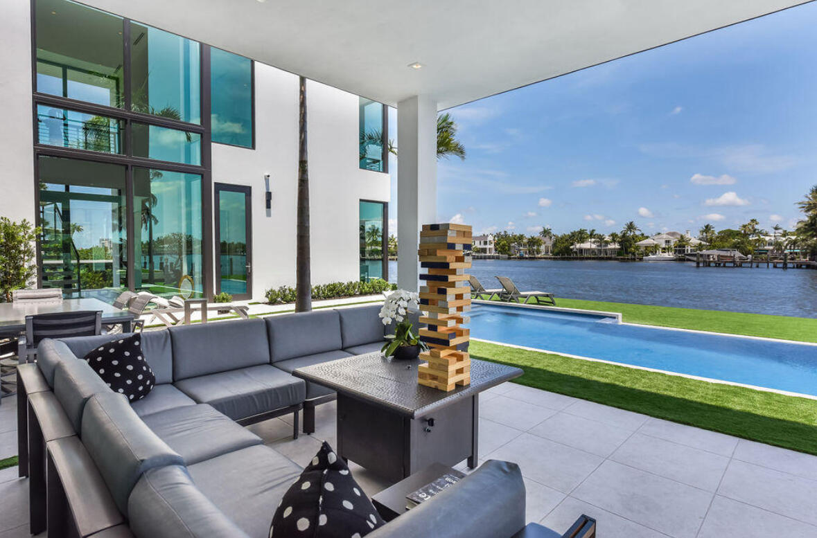 718 Southeast 7th Street Delray Beach, FL 33483 - Photo 19 of 25 a living room with furniture and a floor to ceiling window