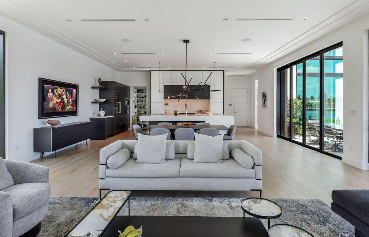 718 Southeast 7th Street Delray Beach, FL 33483 - Photo 4 of 25 a living room with furniture a flat screen tv and a large window