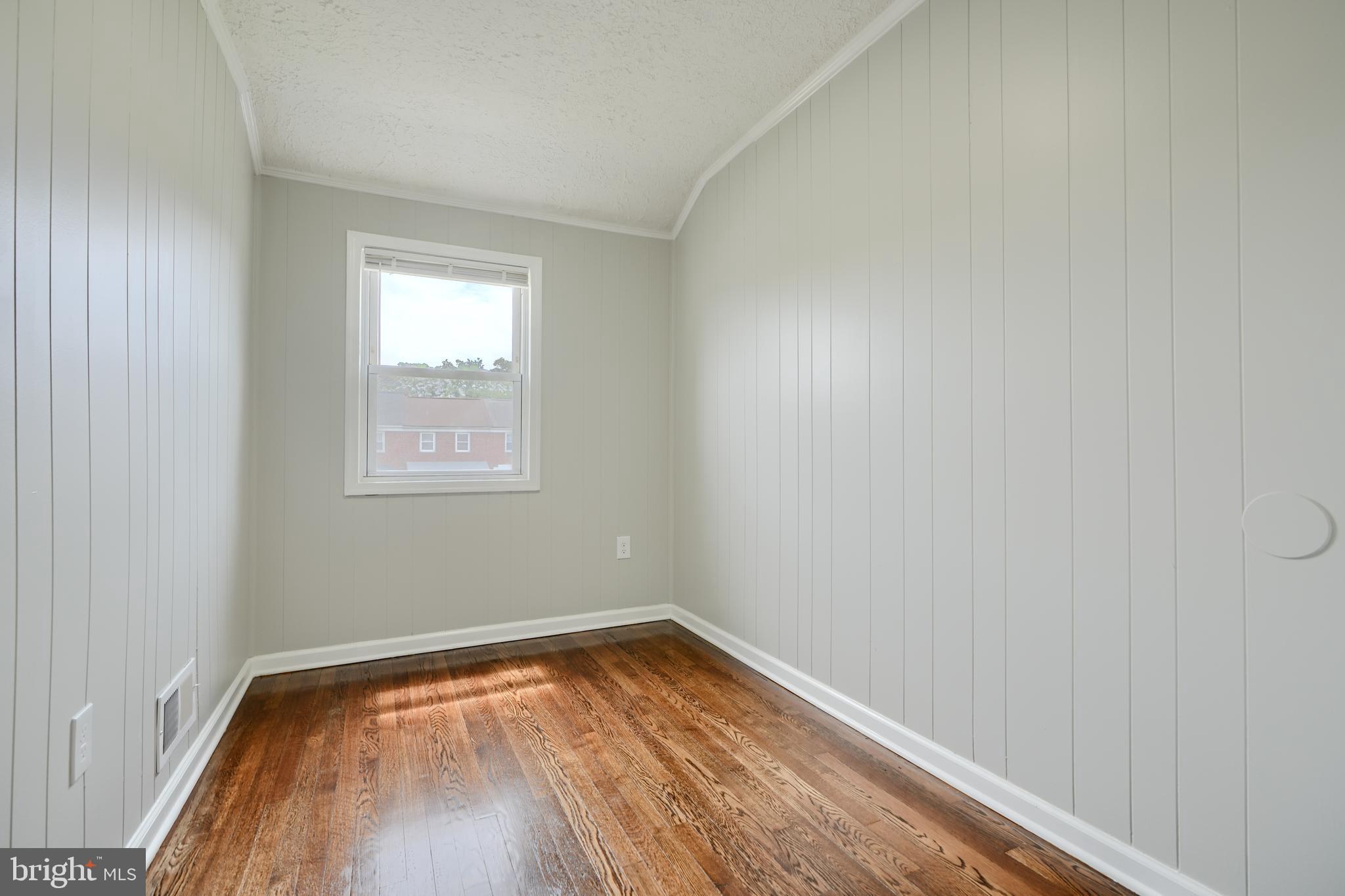1944 Quentin Road Dundalk, MD 21222 - Photo 27 of 41 a view of a room with wooden floor and a window