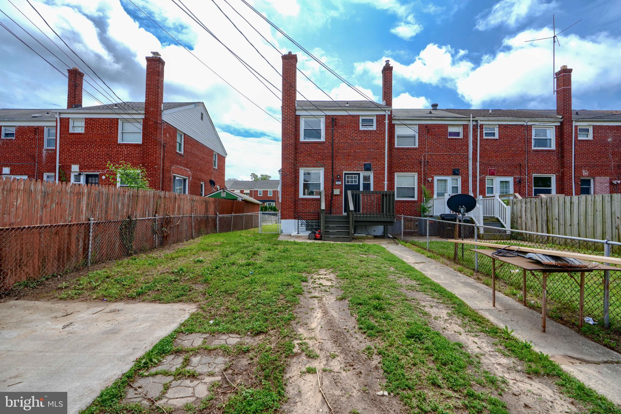 1944 Quentin Road Dundalk, MD 21222 - Photo 40 of 41 a view of a building with a yard and sitting area