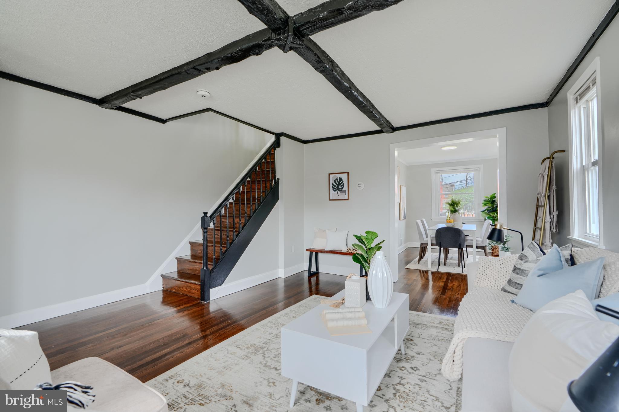 1944 Quentin Road Dundalk, MD 21222 - Photo 5 of 41 a living room with couches and coffee table with wooden floor