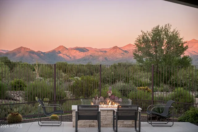 a view of a chairs and table in patio