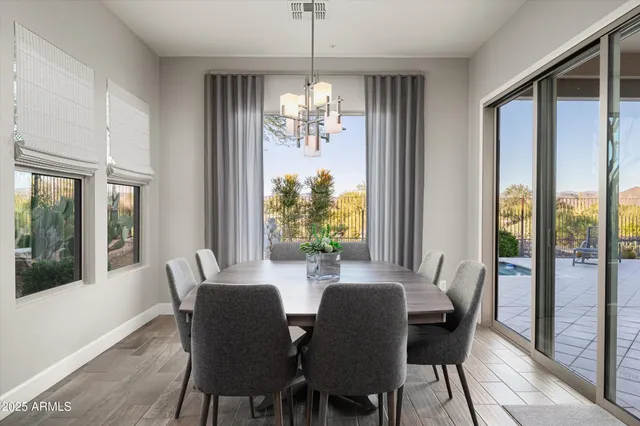 a bathroom with a granite countertop bathtub sink vanity and mirror