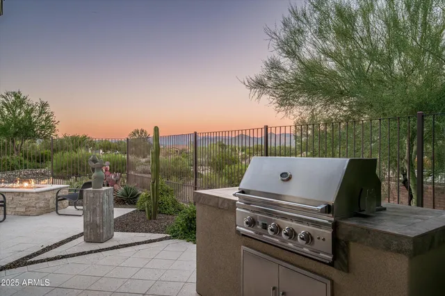 a view of balcony with wooden floor and fence
