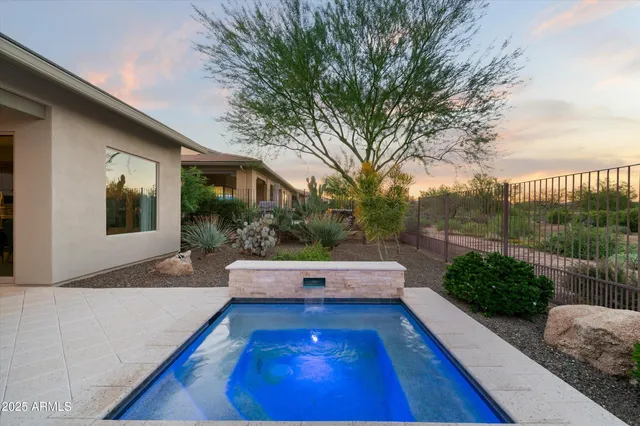 a view of a patio with couches table and chairs and potted plants