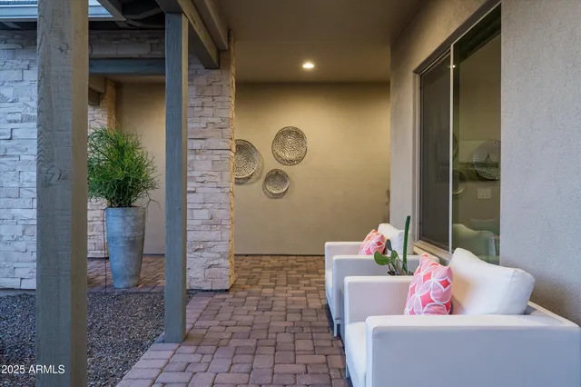 a view of hallway with stairs and wooden floor