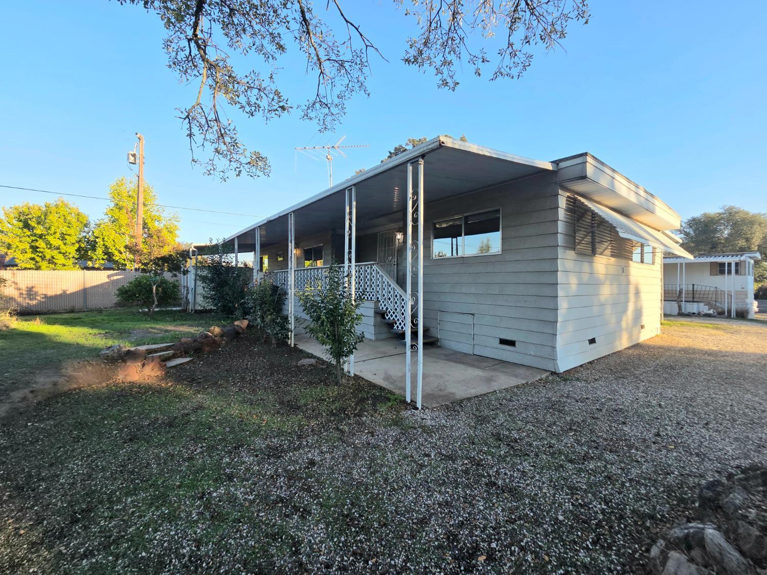 a house view with a backyard space