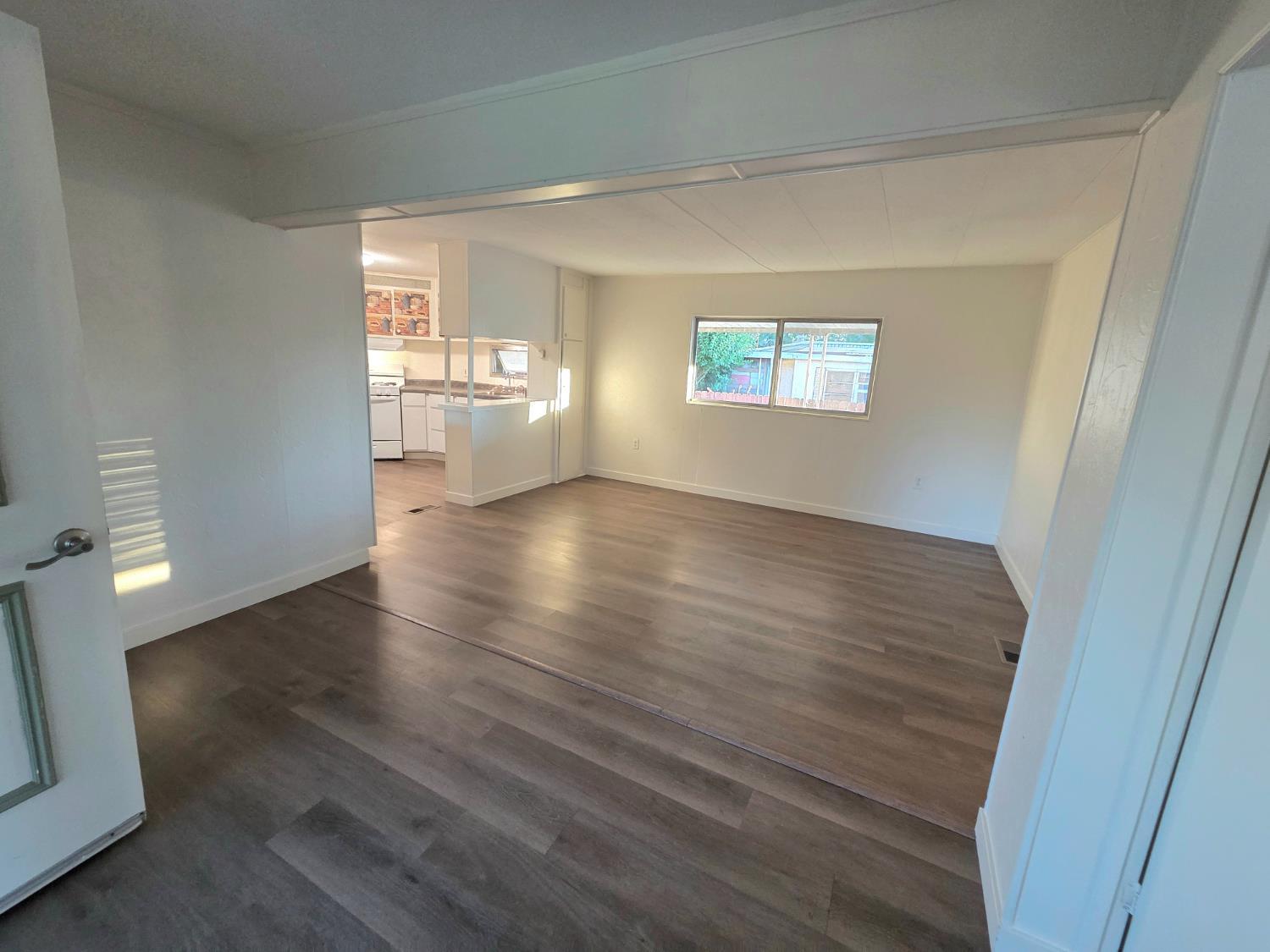 5200 Cavitt Stallman Road, Unit 1 Granite Bay, CA 95746 - Photo 12 of 41 an empty room with wooden floor and windows