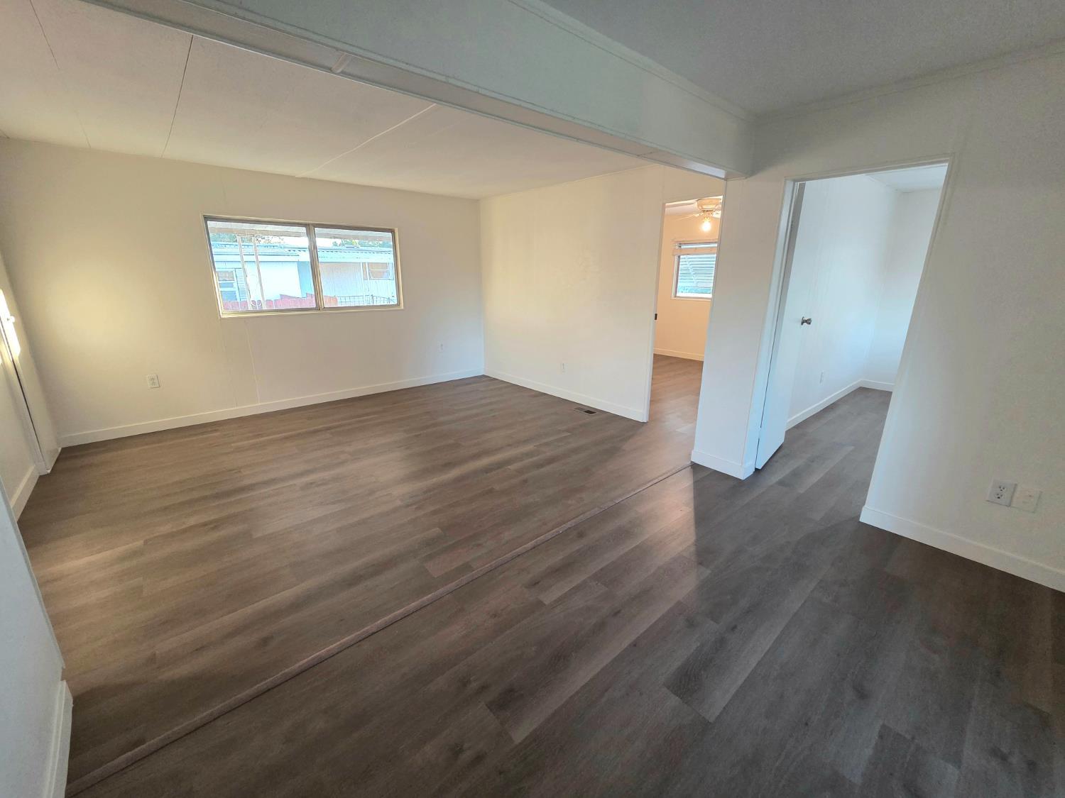 5200 Cavitt Stallman Road, Unit 1 Granite Bay, CA 95746 - Photo 13 of 41 a view of an empty room with wooden floor and a window