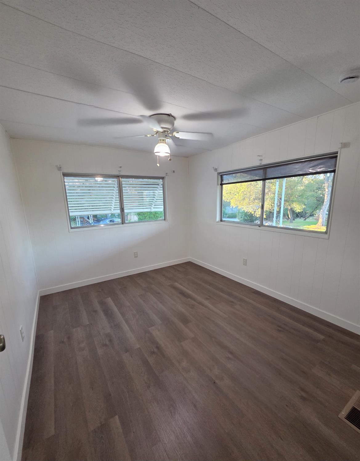 5200 Cavitt Stallman Road, Unit 1 Granite Bay, CA 95746 - Photo 14 of 41 an empty room with wooden floor and windows
