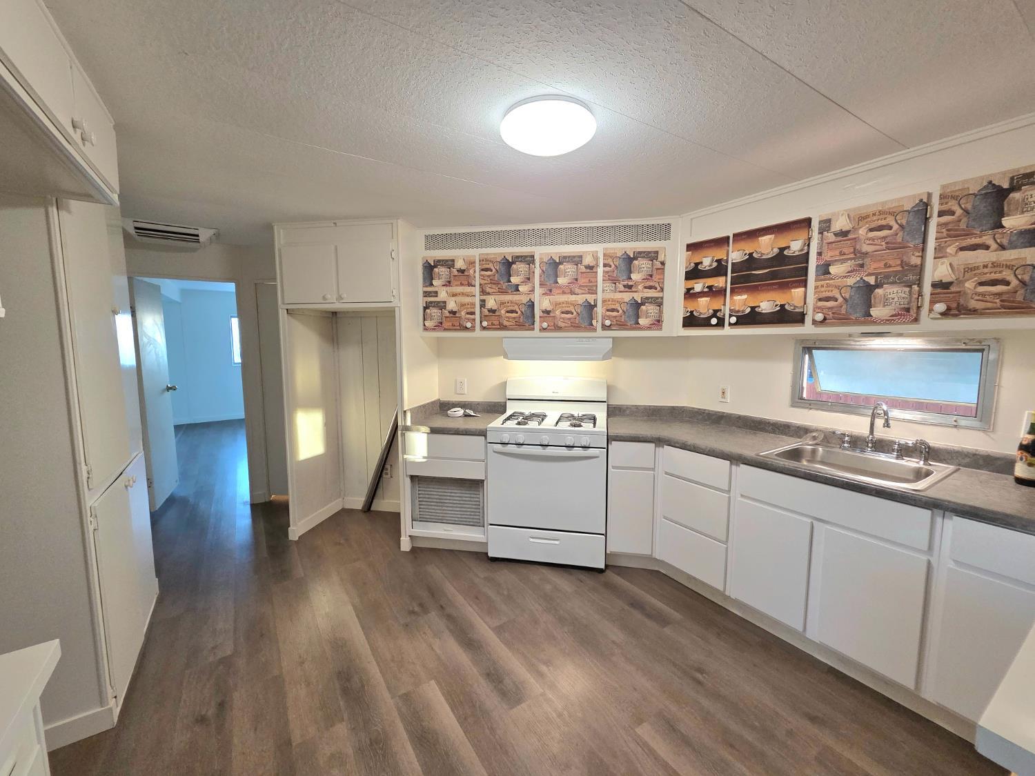 5200 Cavitt Stallman Road, Unit 1 Granite Bay, CA 95746 - Photo 20 of 41 a kitchen with stainless steel appliances granite countertop a stove a sink and a refrigerator