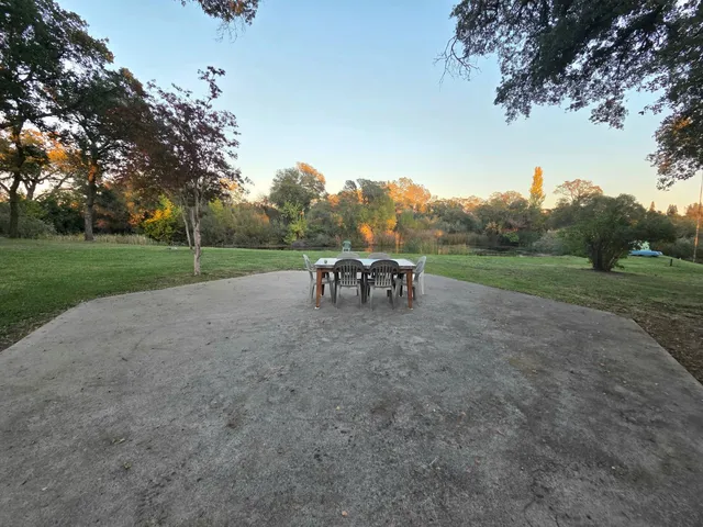 a view of outdoor space with playground and green space