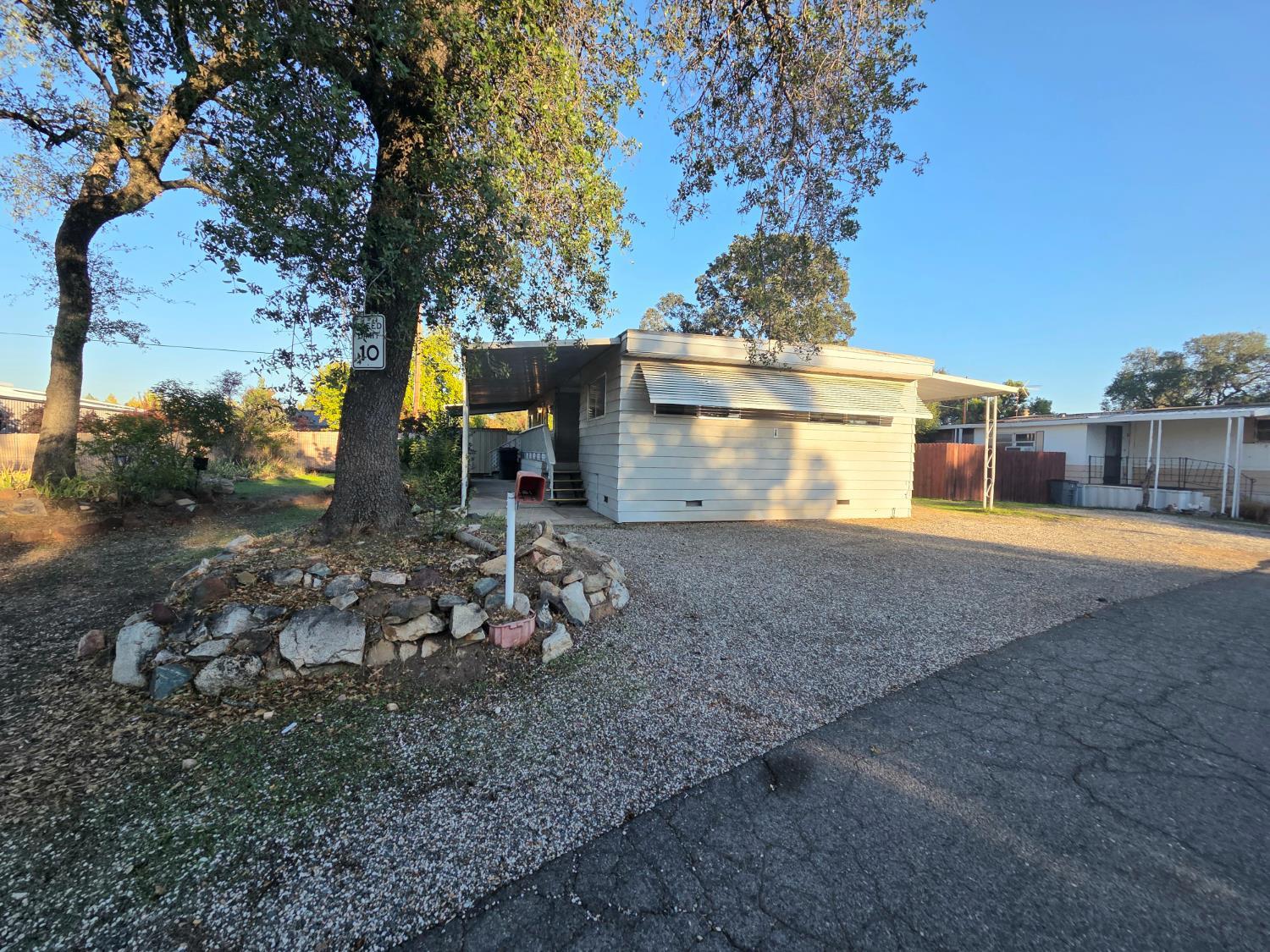 5200 Cavitt Stallman Road, Unit 1 Granite Bay, CA 95746 - Photo 4 of 41 a view of a house with backyard and a tree