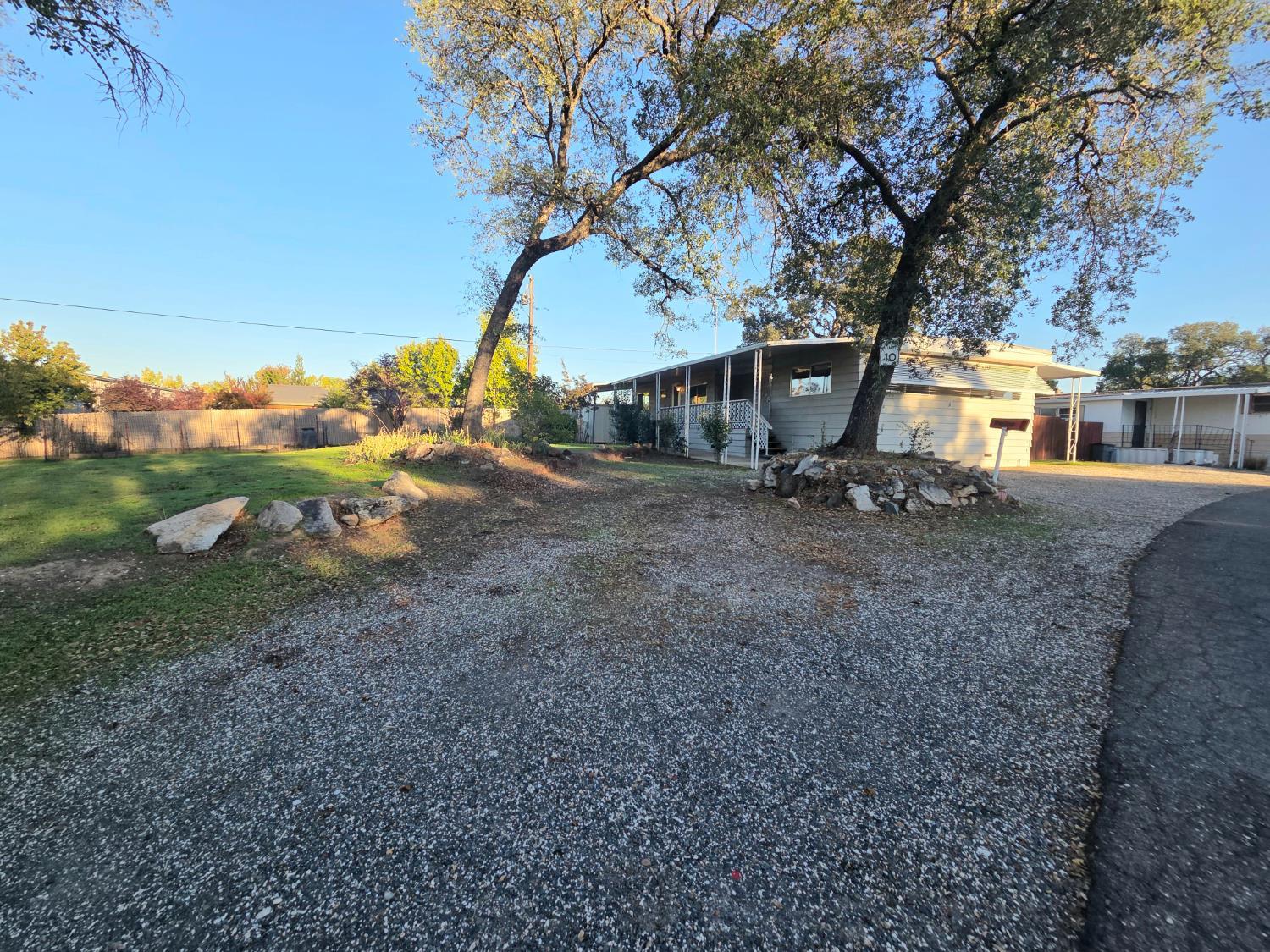 5200 Cavitt Stallman Road, Unit 1 Granite Bay, CA 95746 - Photo 5 of 41 a backyard of a house with fountain table and chairs
