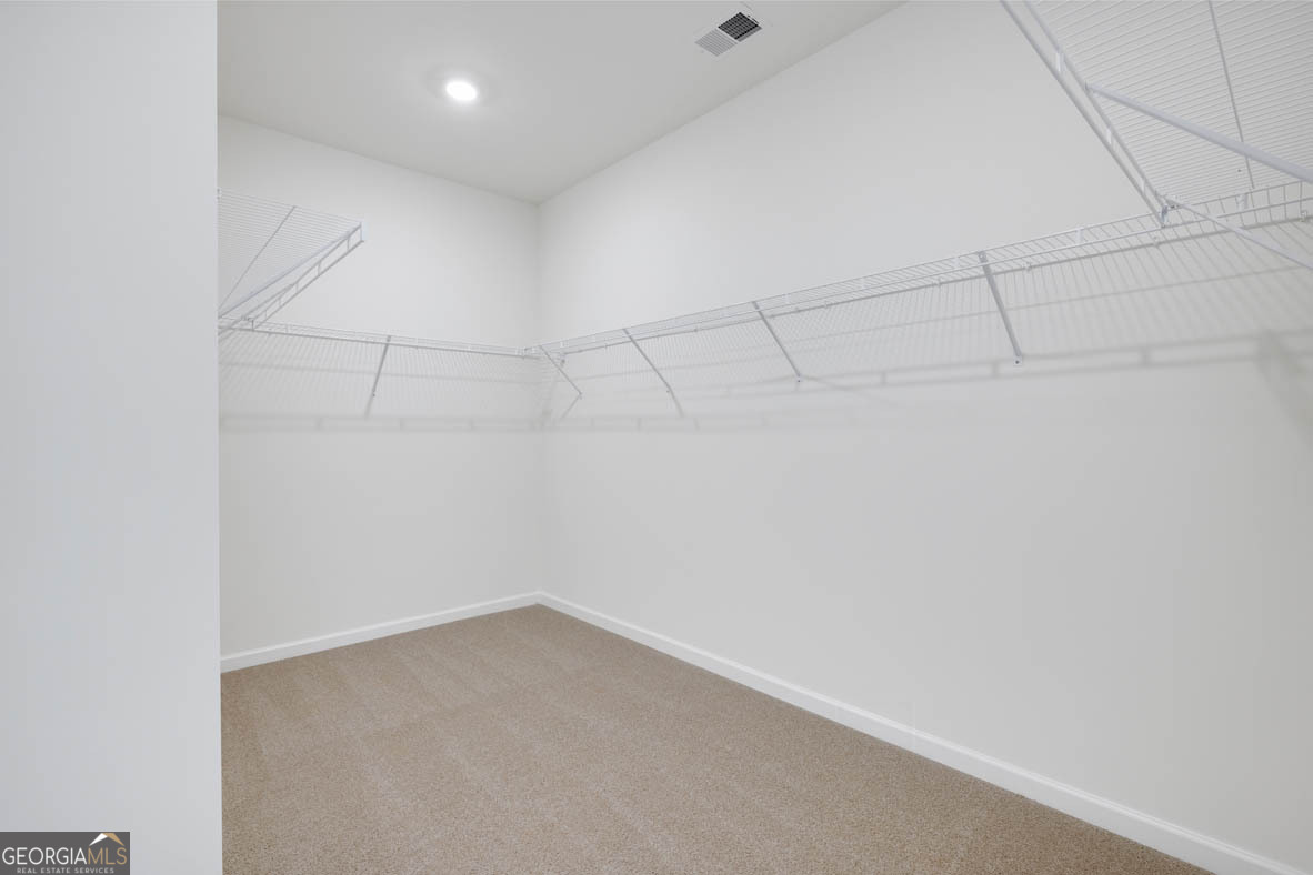 1801 Quaker Hampton, GA 30228 - Photo 15 of 37 a view of a room with racks on the wall