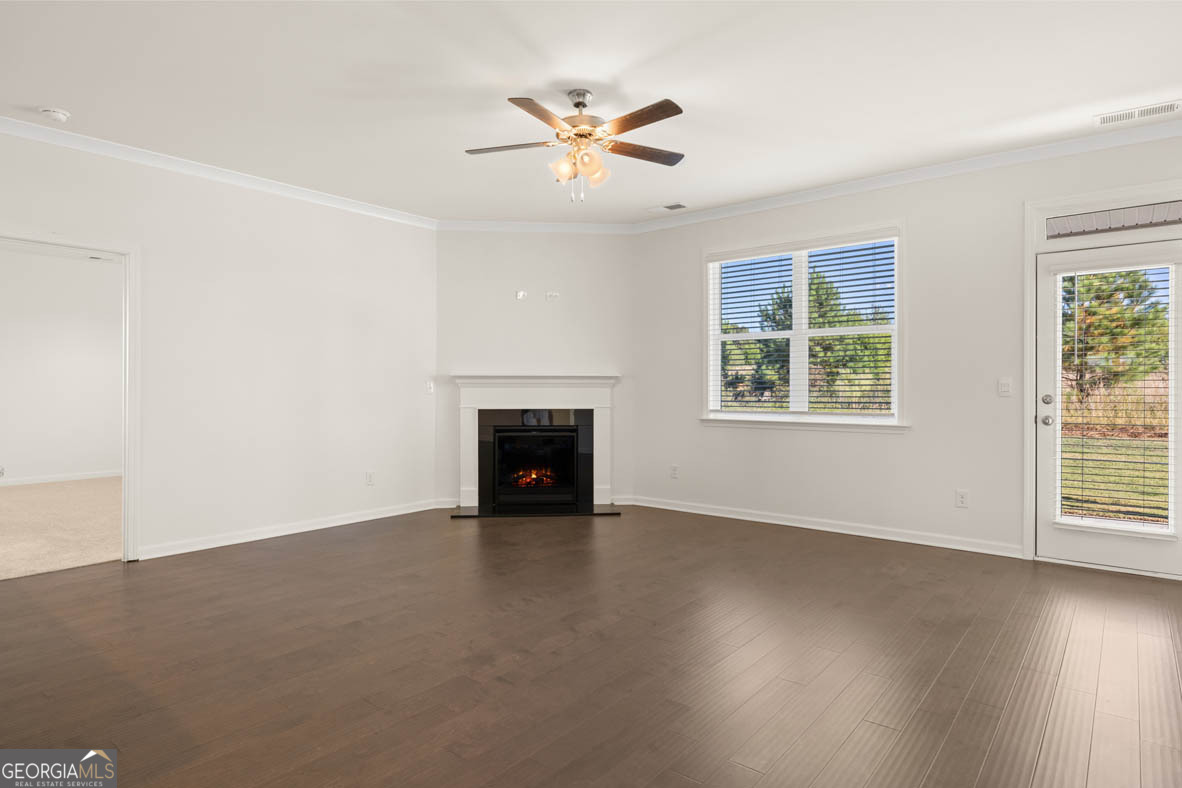 1801 Quaker Hampton, GA 30228 - Photo 16 of 37 an empty room with windows and ceiling fan