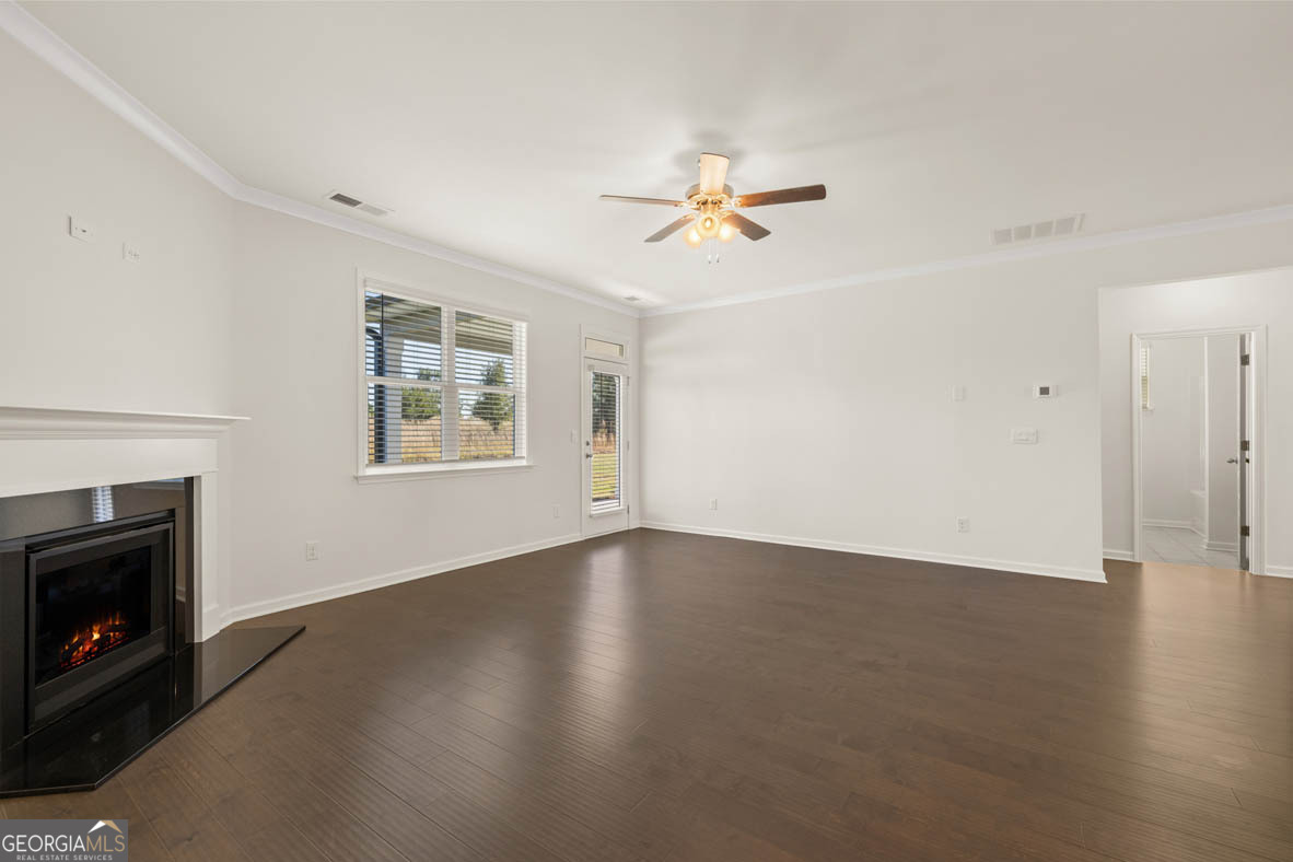 1801 Quaker Hampton, GA 30228 - Photo 17 of 37 a view of empty room with a fireplace and wooden floor