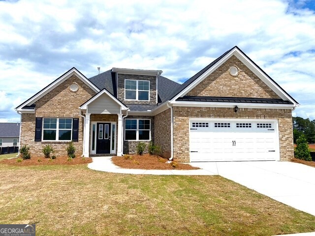 1801 Quaker Hampton, GA 30228 - Photo 21 of 37 a front view of a house with a yard
