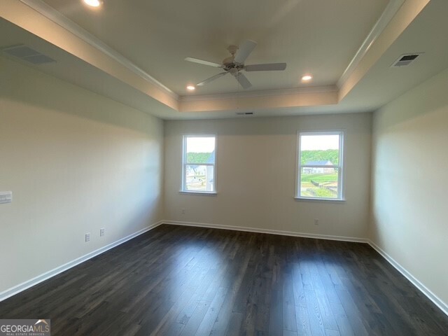 1801 Quaker Hampton, GA 30228 - Photo 25 of 37 an empty room with wooden floor and windows
