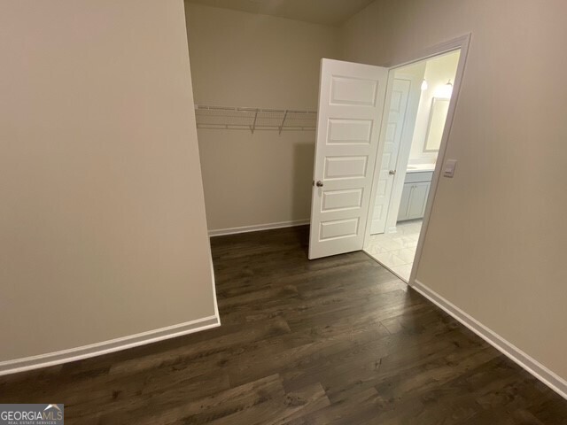 1801 Quaker Hampton, GA 30228 - Photo 32 of 37 an empty room with wooden floor and closet