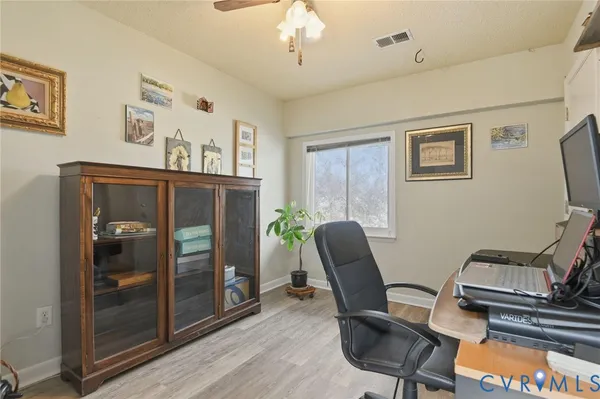 a bathroom with a sink and mirror with shower