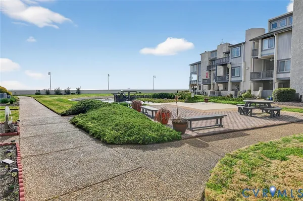 a view of a backyard with sitting area