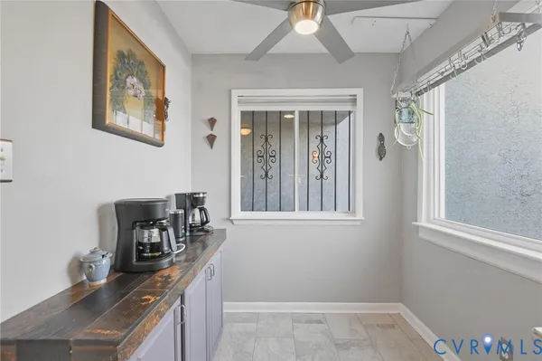 a view of a hallway with wooden floor and stairs