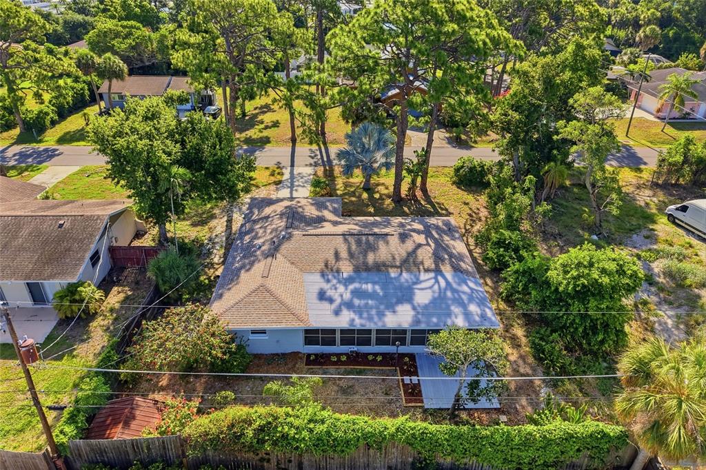 5984 Diana Road Venice, FL 34293 - Photo 3 of 36 an aerial view of a house with a yard and large trees