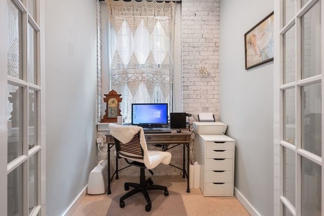 a bedroom with a bed and flat screen tv
