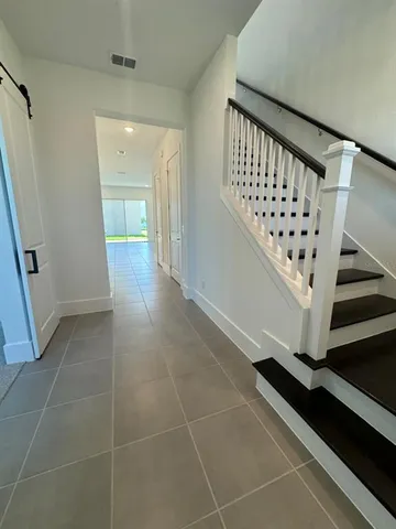 a view of an entryway with a workspace