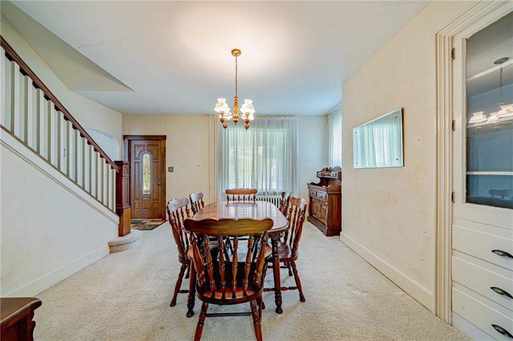 2375 Mt Pleasant Road Ruffs Dale, PA 15679 - Photo 12 of 31 a dining room with furniture and chandelier