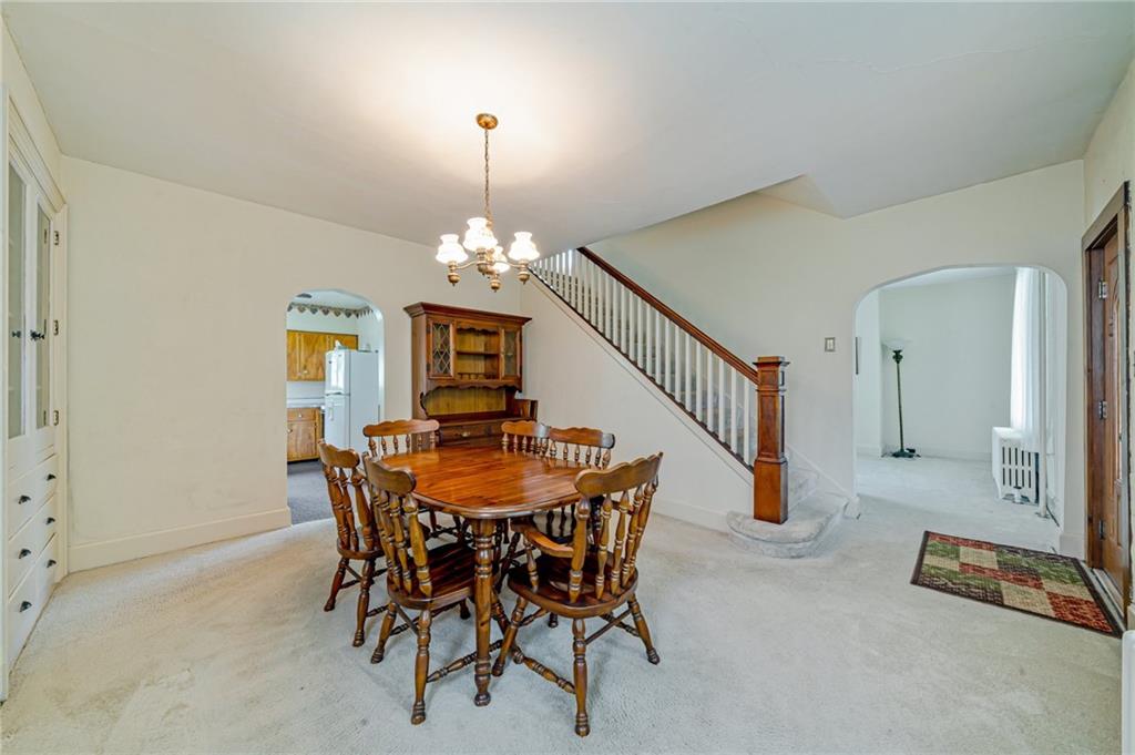 2375 Mt Pleasant Road Ruffs Dale, PA 15679 - Photo 14 of 31 a view of a dining room with furniture and chandelier