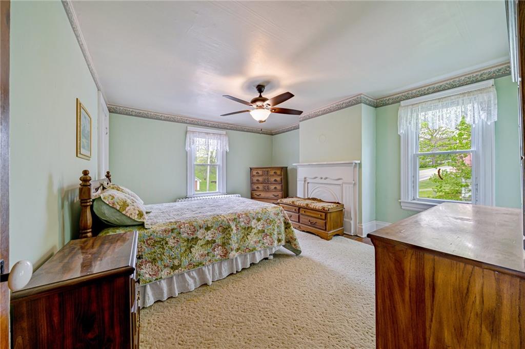 2375 Mt Pleasant Road Ruffs Dale, PA 15679 - Photo 18 of 31 a bedroom with a bed and dresser with mirror
