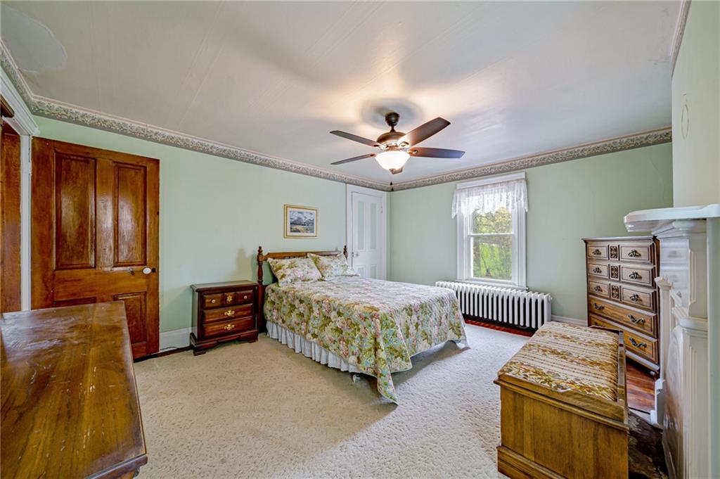 2375 Mt Pleasant Road Ruffs Dale, PA 15679 - Photo 19 of 31 a bedroom with bed and window