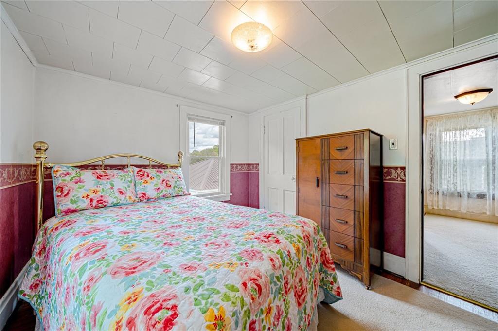 2375 Mt Pleasant Road Ruffs Dale, PA 15679 - Photo 21 of 31 a bedroom with a bed and a dresser