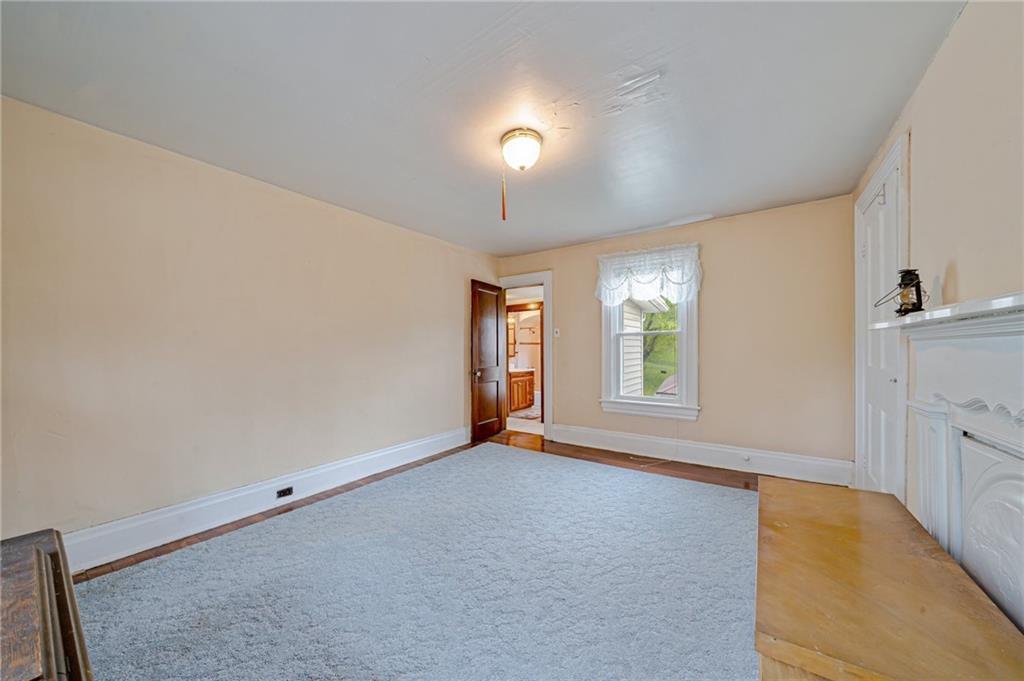 2375 Mt Pleasant Road Ruffs Dale, PA 15679 - Photo 23 of 31 a view of an empty room with window and wooden floor