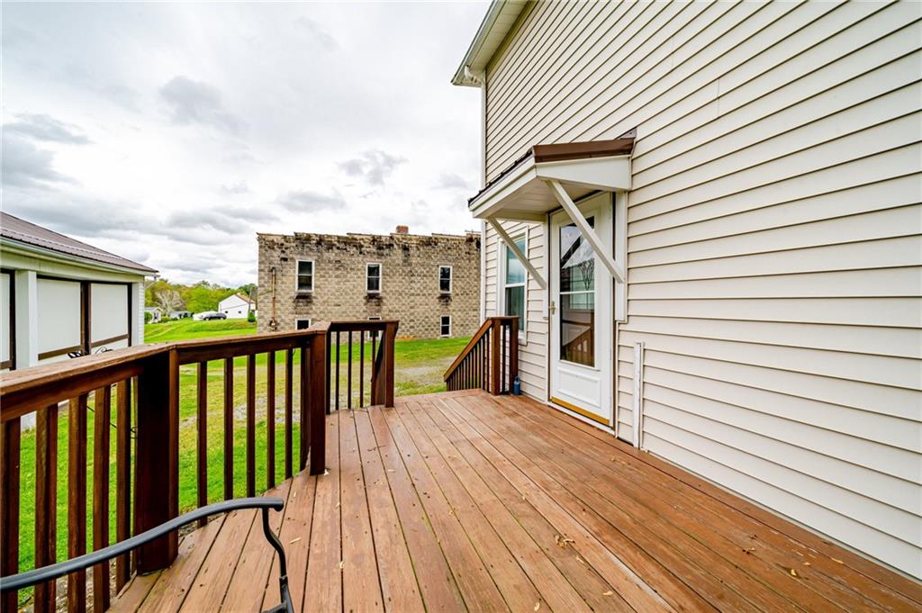 2375 Mt Pleasant Road Ruffs Dale, PA 15679 - Photo 27 of 31 a view of a balcony with wooden floor and stairs