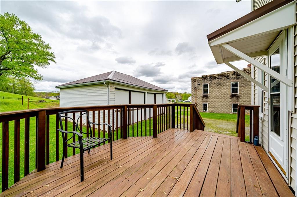 2375 Mt Pleasant Road Ruffs Dale, PA 15679 - Photo 28 of 31 a view of a balcony with wooden floor and fence