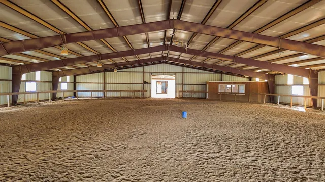 a living room with a table and chairs