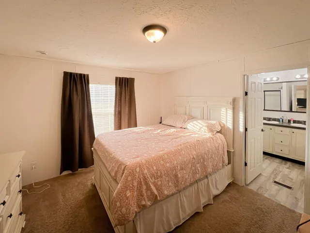 a bed room with two beds and a couch