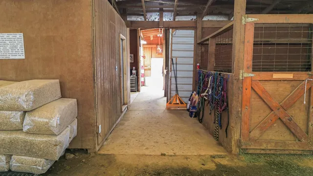 a view of a porch with a door and wooden floor