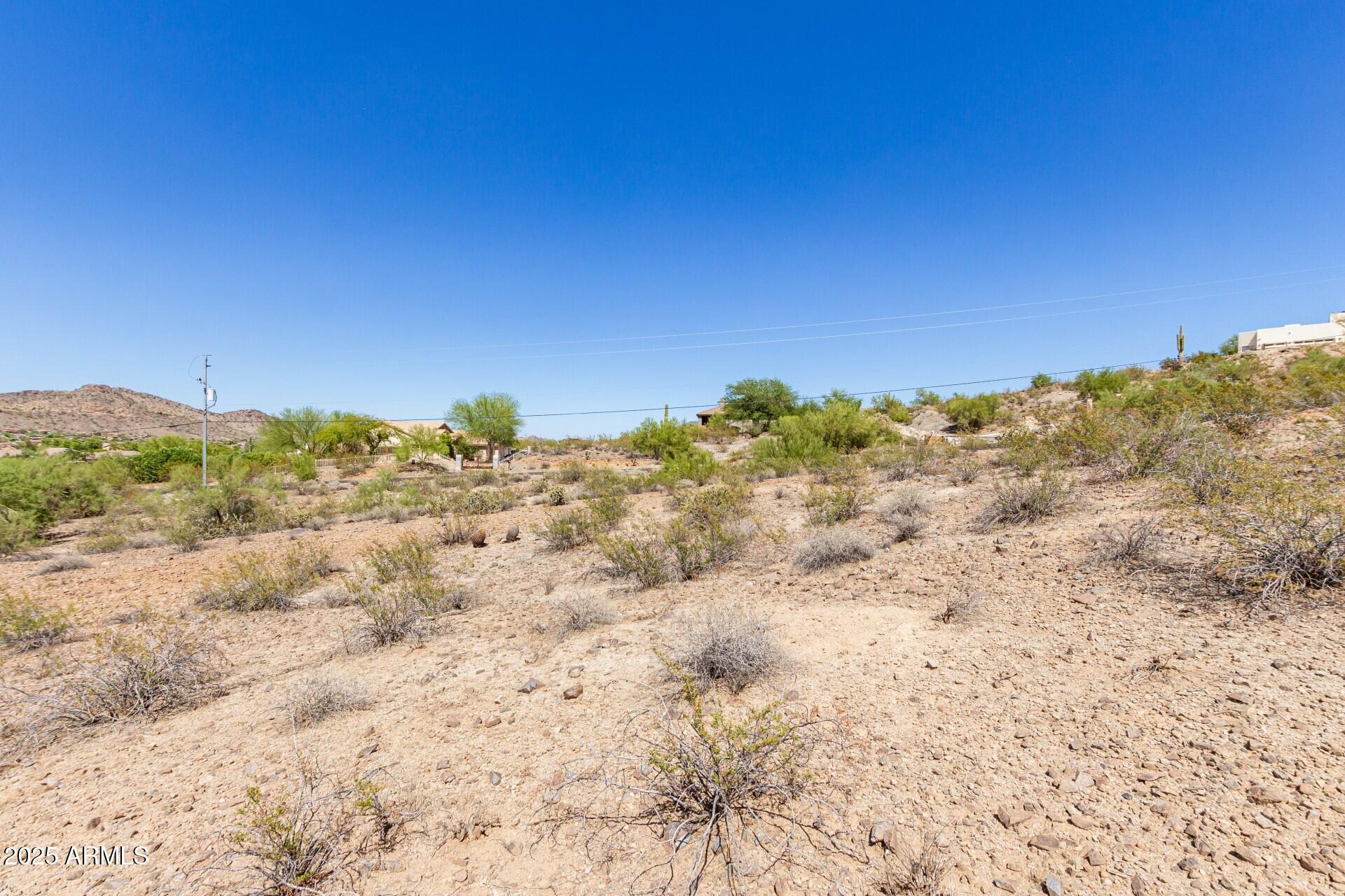 9303 West Briles Road, Unit 4 Peoria, AZ 85383 - Photo 12 of 20 a view of a large building with view of trees