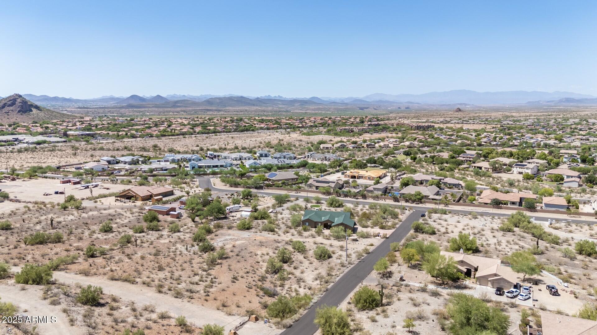 9303 West Briles Road, Unit 4 Peoria, AZ 85383 - Photo 15 of 20 an aerial view of residential houses with outdoor space