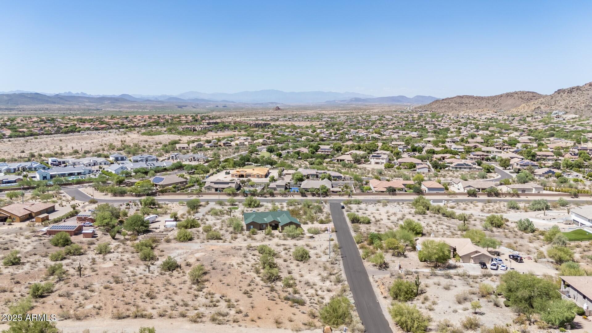 9303 West Briles Road, Unit 4 Peoria, AZ 85383 - Photo 17 of 20 an aerial view of residential houses with outdoor space