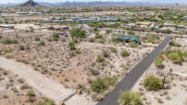 view of a mountain range in a cloudy sky